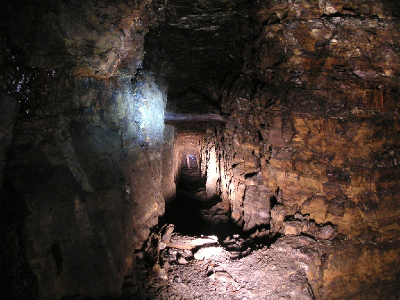 fs_2nd_entrancepassage.jpg - The photograph before is at the junction, where this passage goes back towards the surface at a different angle. Ambrose went to have a look and saw a bit of day light, some digging and a new exit was formed. You can just about see the light at the end of the tunnel.