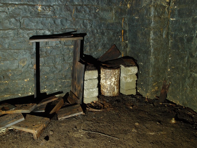 P5253059.JPG - Broken cupboard and drum in No2 Shaft engine room.
