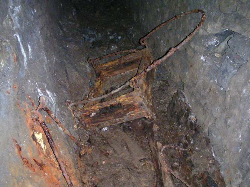 sc_artifact.jpg - Just before entering Barron's Sump in a passage near it is this wooden box with iron loops - was it for haulage of tools?
