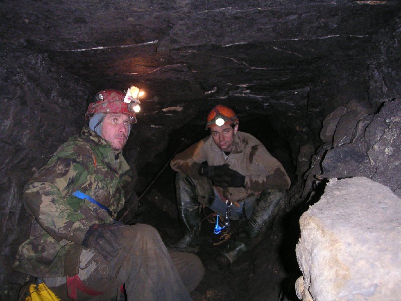 PICT0003.JPG - At the bottom of Proud sump. The passage splits into 2, one used to take you into Carr's mine, but this has been bricked up, so that the show mine does not get unexpected visitors. The other takes you to another shaft and working.