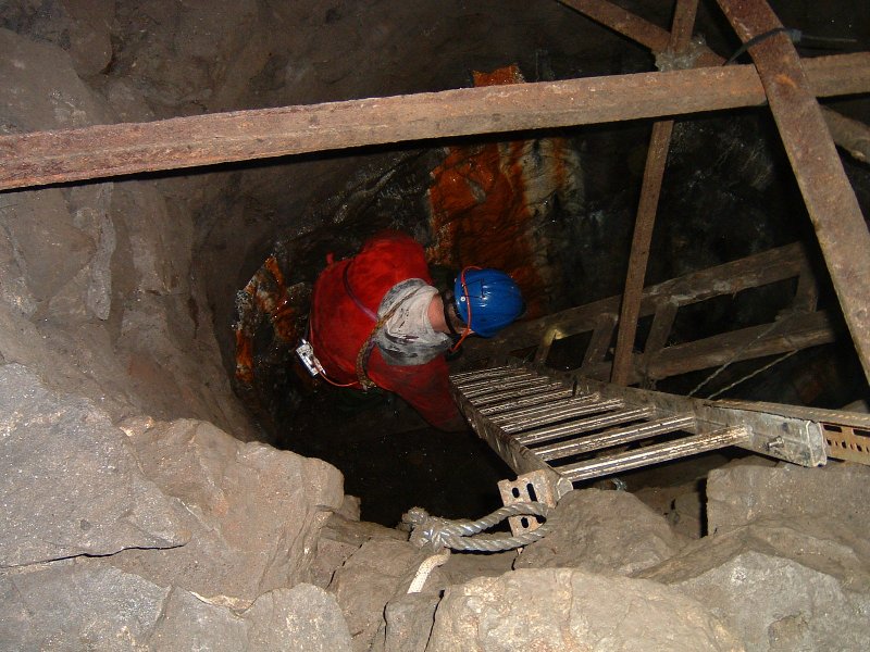 sc_oreshoot_to_rampgill2.jpg - From the workings below Proud's sump there is a ore shoot and another shaft that both connect to another level, which we believe to be Rampgill. The passage is not collapsed but flooded to above wader depth. Speaking to other explorers we found out that if you follow the water down stream you come out near Whisky Bottle junction in Rampgill - a trip we hope to do. There is another set of workings accessable from this level, which means a climb up a rise - to be explored.