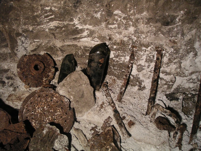 sc_crosscut_longcleugh_to_middlecleughnorthvein_artifacts1.jpg - To reach the end of the cross cut you have to cross a sump, immediately past it there is a whole range of artifacts. Here you can see pipe couplings, chisels, bottles, tins to name a few.