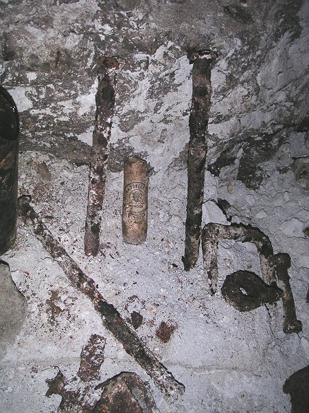 sc_crosscut_longcleugh_to_middlecleughnorthvein_artifacts2.jpg - To reach the end of the cross cut you have to cross a sump, immediately past it there is a whole range of artifacts. Here you can see pipe couplings, chisels, bottles, tins to name a few.