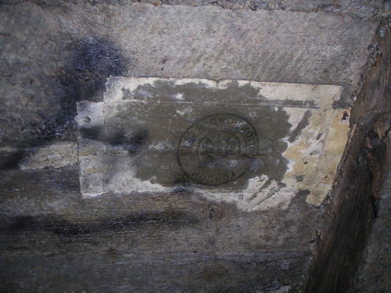 sc_sublev_concretelabel.jpg - In the main level that serviced the stope above an explosives label could be seen stuck to the concrete arching, this probably was used to block up a hole in the shuttering used to form the arching.