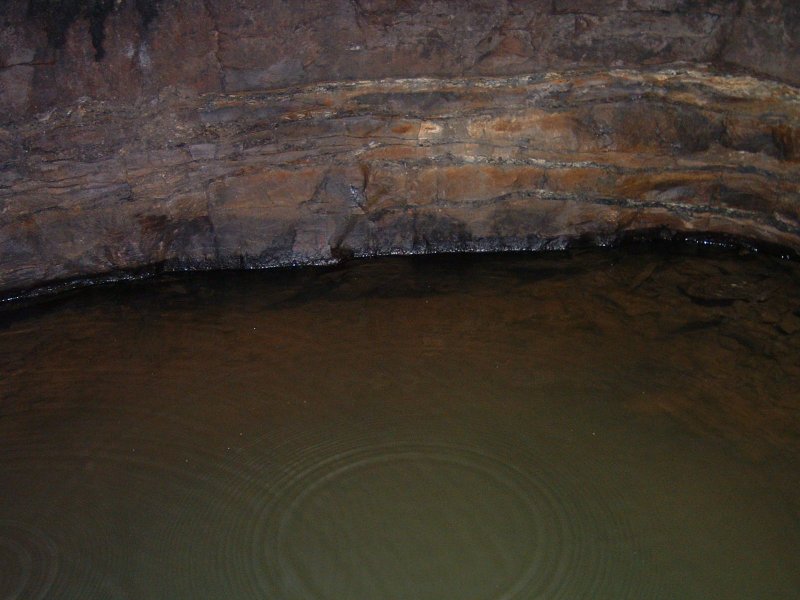 sc_middlecleugh_2nd_sunvein3.jpg - The Middlecleugh Second Sun Vein passage in parts is flooded, and this is one of the sumps which used to drain it all away, looking greeny blue and deep.
