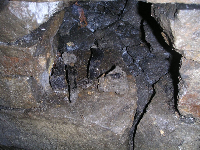 lc_lcvein_pegsandcandle.jpg - Just at the junction in a little pocket in the walling we saw these wooden pegs and candle.