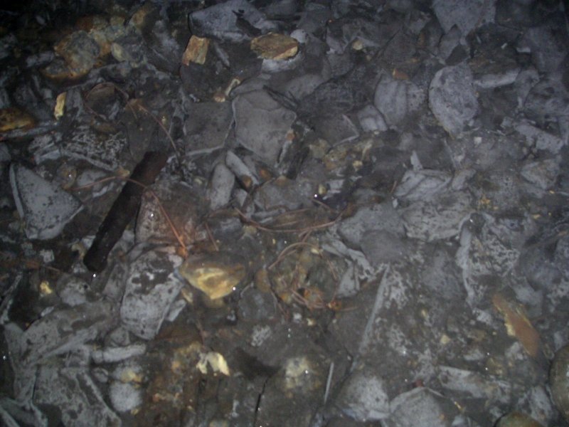 Pict0017.jpg - After dropping down to sub level 2 we had to do a short grotty crawl, and on the right we came across a small chamber which had quite a few artifacts. In this picture, lots of detonator fuse.