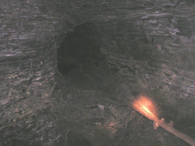 Pict0027.jpg - The link to Flatt Cross Cut from Smallcleugh Cross Vein, it is a shaft with some rail tracks piled on one side for crossing assistance.