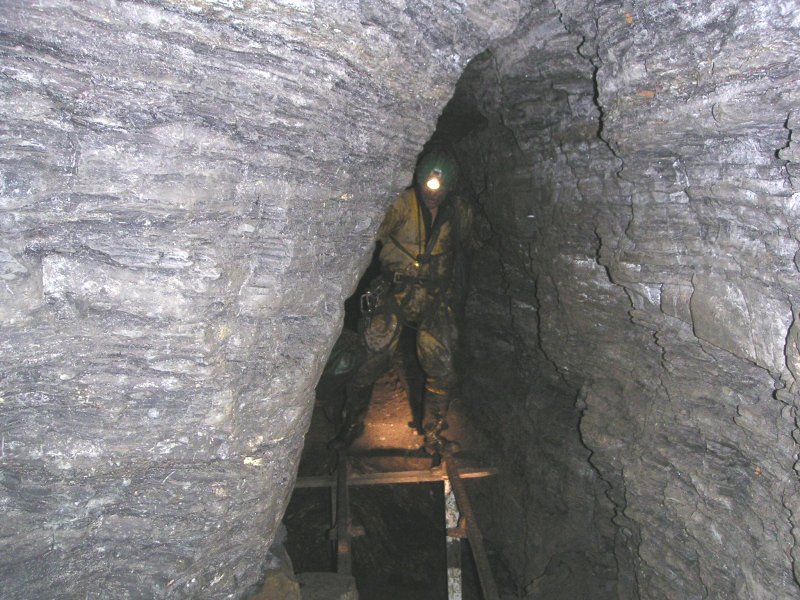 Pict0029.jpg - In the passage there is a floor collapse that you can get over via the rail tracks, Mark doing a bit of Indiana Jones.