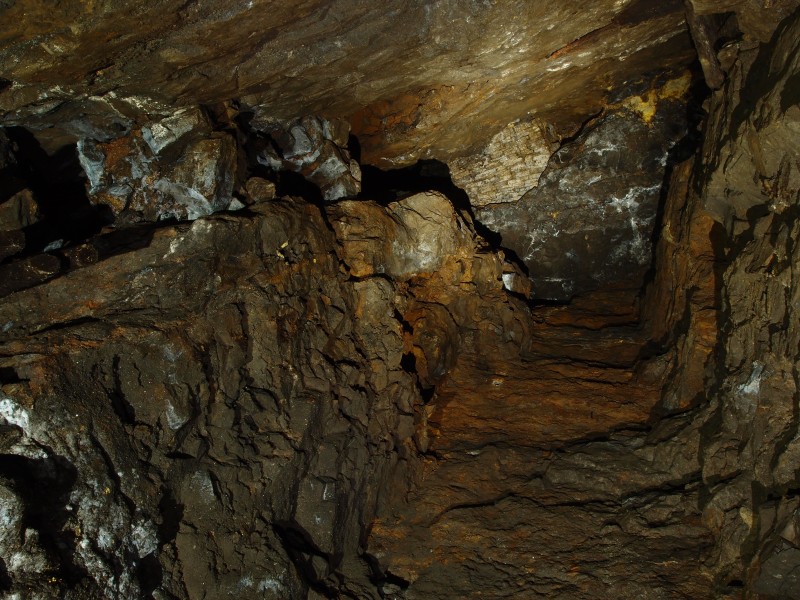 PC028627.JPG - Looking up from the bottom of the hopper / manway sump in the understope. Arching from the horse level roof can be seen.