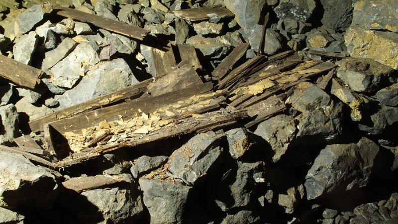 P4023361.JPG - The current remains of the explosives box and gun powder wrappers. Deteriorated even more now and the powder flask seems to have gone.