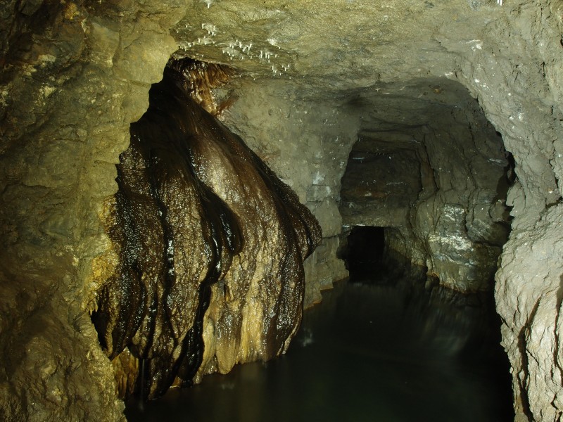 PA296670.JPG - Large calcite flow from rise in the flooded section. Junction of Tynebottom A Level and North Vein.